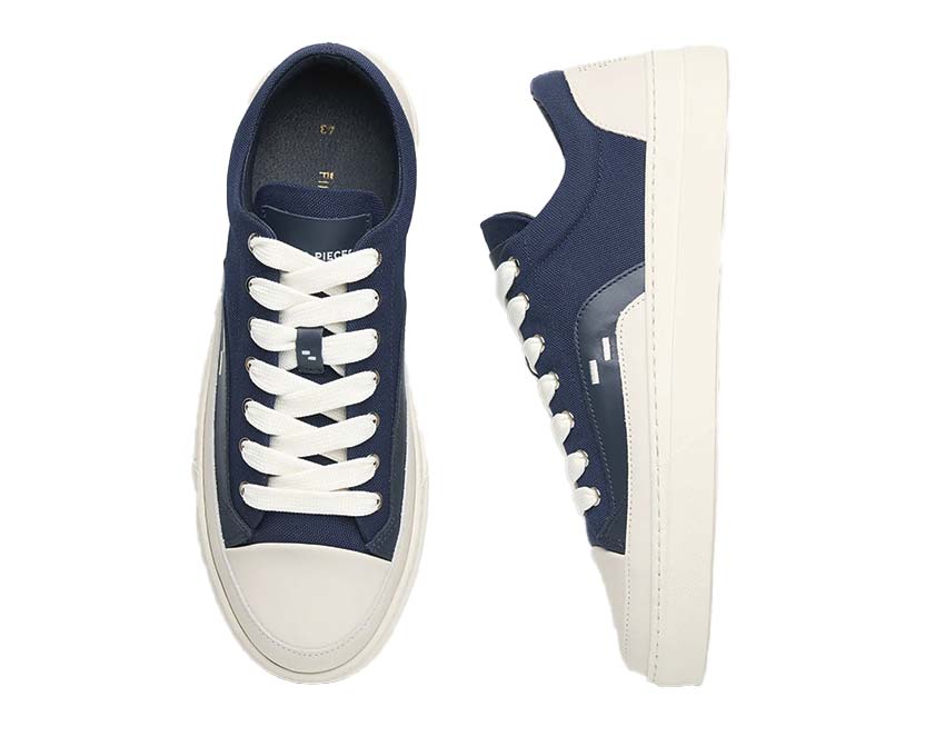 Filling Pieces Riviera Low Navy Detail — Filling Pieces Logo