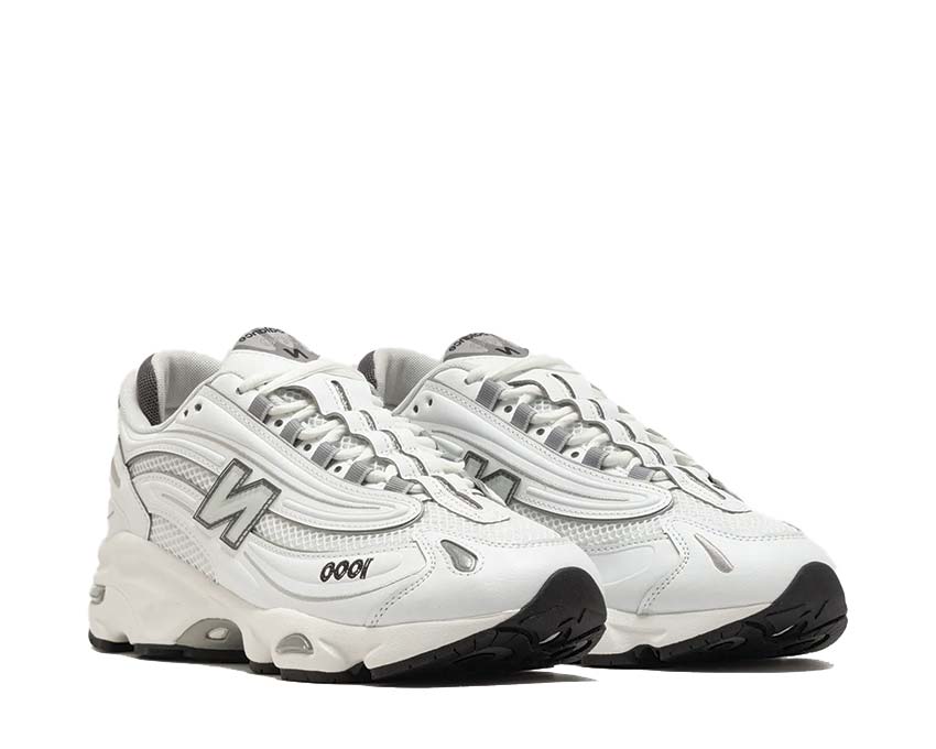 New Balance 1000D White vue latérale — silhouette trail urbain tout-blanc