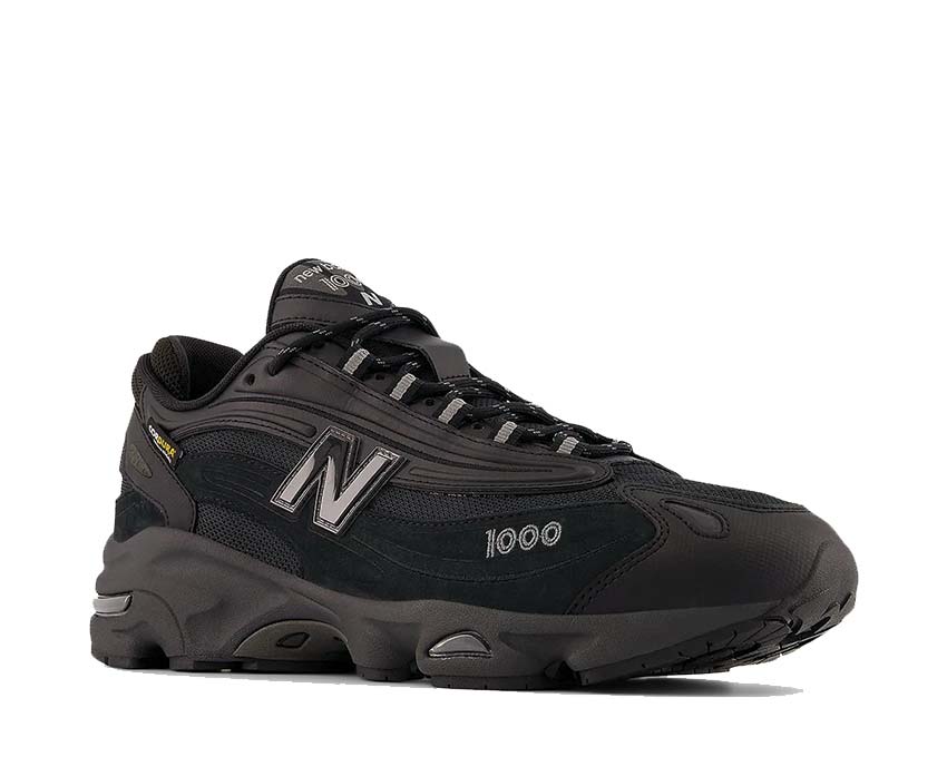 New Balance 1000 Cordura Black vista laterale — tomaia Cordura nera monocromatica