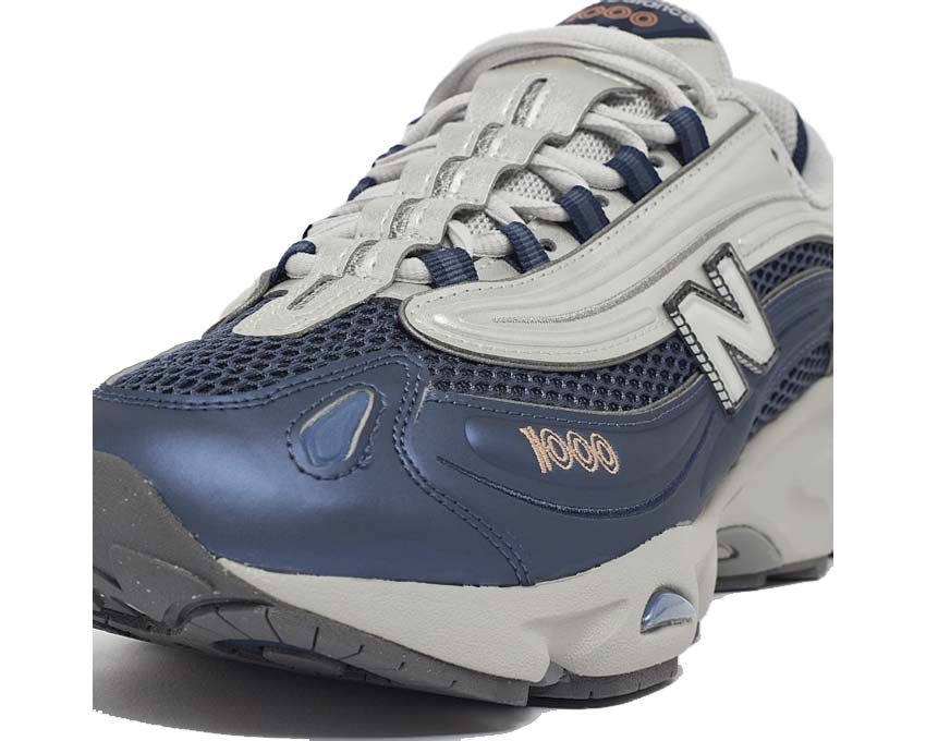 New Balance 1000 Vintage Indigo vista laterale — tomaia in pelle e nubuck tonalità blu profondo