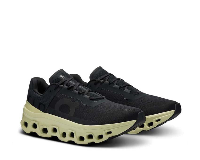 On Cloudmonster Black/Acacia vista laterale — profilo ammortizzazione massimo uomo
