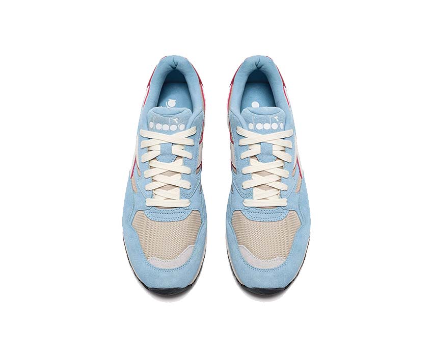 Diadora N902 Oyster Gray Dusk Blue detail — embroidered logo side panel